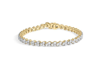 Yellow metal bracelet with prong-set round white gemstones, shown from a slightly angled top view.