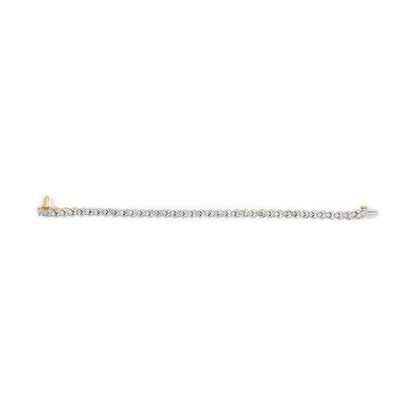 Top-down view of a yellow metal bracelet featuring a continuous line of round white gemstones in prong settings.