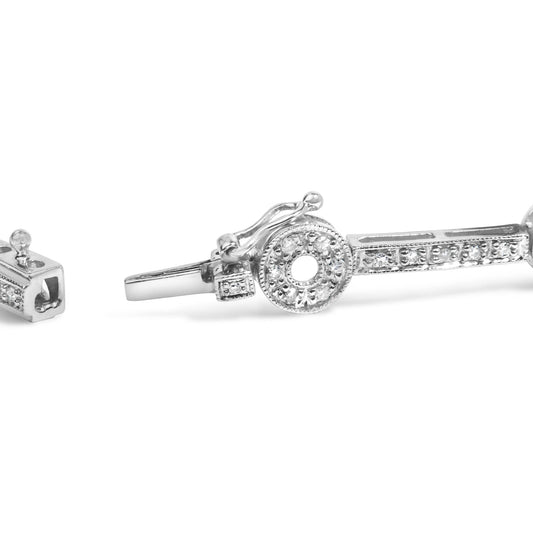 Close-up angled view of a white metal bracelet featuring round white gemstones in prong settings with a circular centerpiece and a detailed clasp.