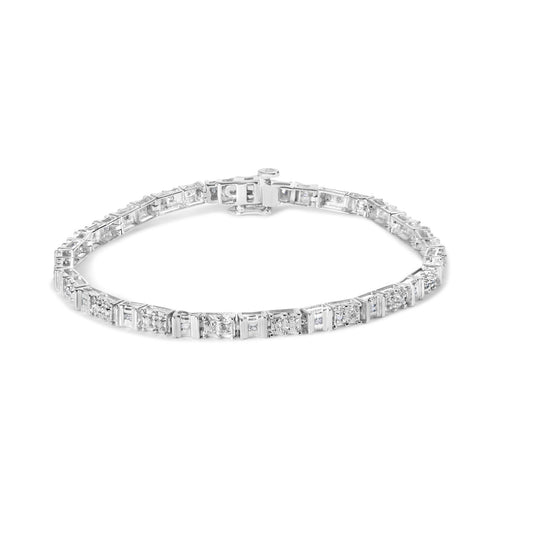 White metal bracelet with alternating round and baguette shaped white gemstones in pave and channel settings, shown from a top angle.