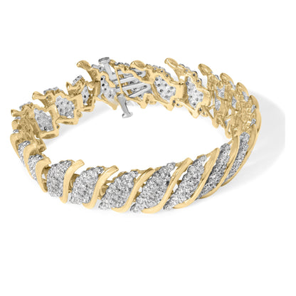 Yellow metal bracelet with alternating curved sections set with white round gemstones in prong settings, shown at a slight top-front angle.