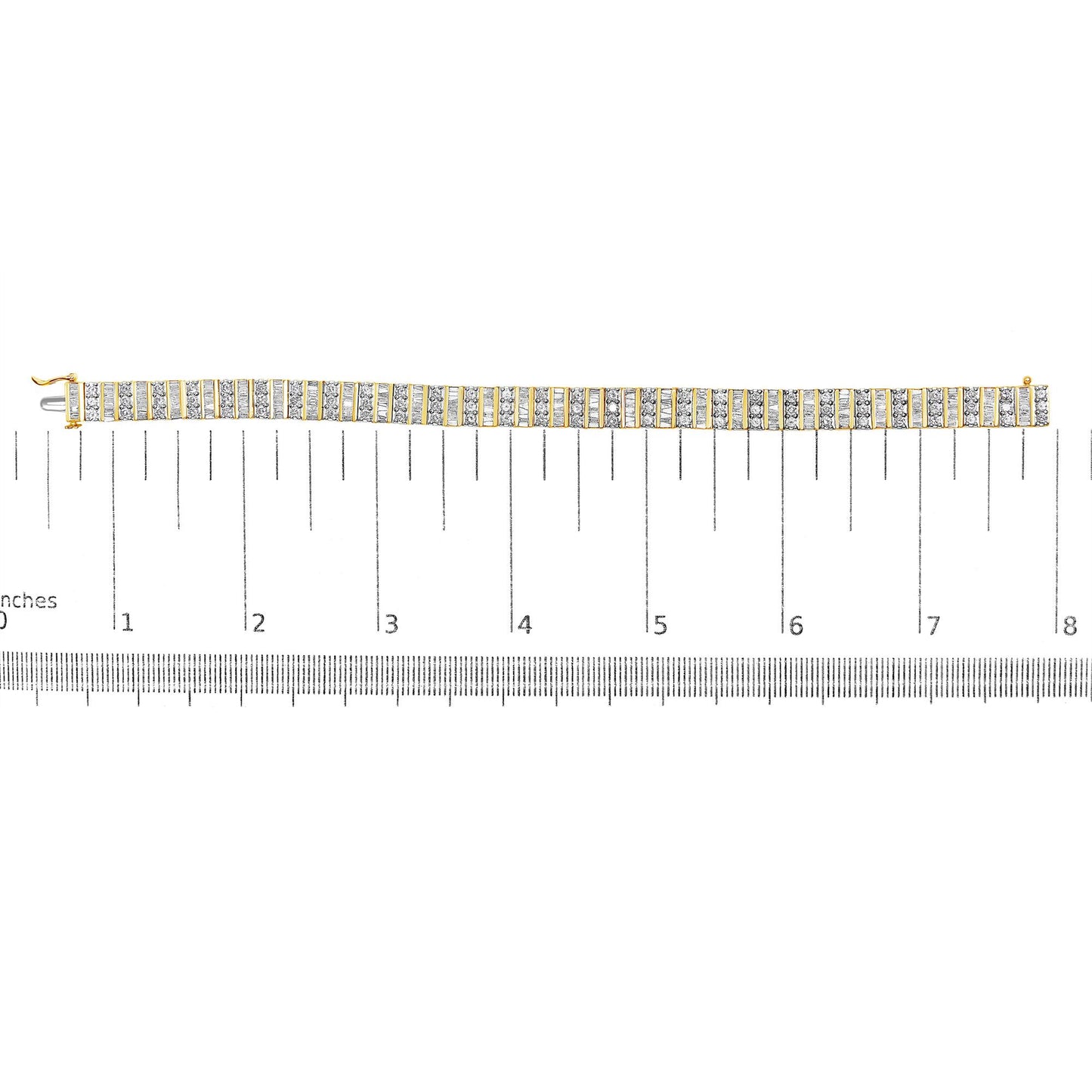 Top-down view of a yellow metal bracelet with alternating rows of round prong-set white gemstones and baguette channel-set white gemstones, displayed on a ruler for size reference.