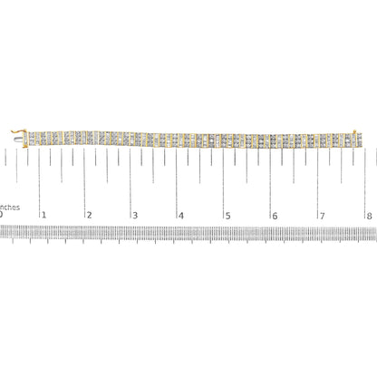 Top-down view of a yellow metal bracelet with alternating rows of round prong-set white gemstones and baguette channel-set white gemstones, displayed on a ruler for size reference.