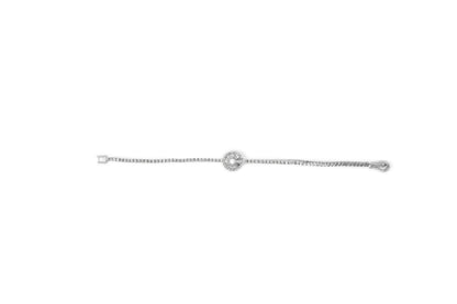 White bracelet with round prong-set and baguette channel-set white gemstones centered around a circular clasp, shown from a top-down angle.