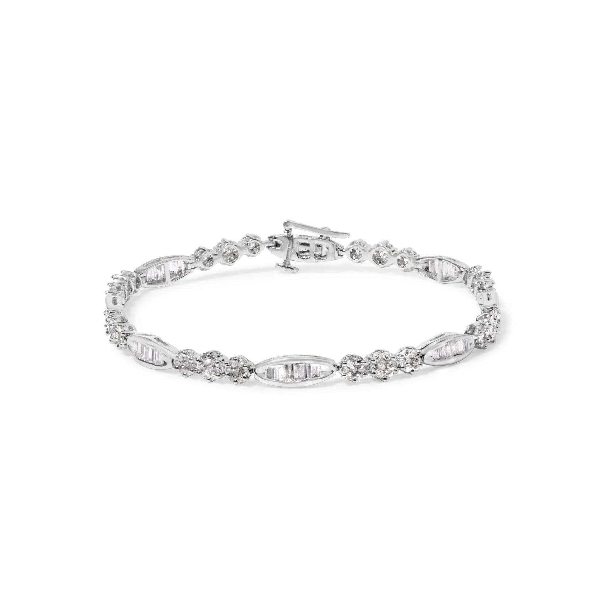 White metal bracelet with alternating sections of baguette-shaped gemstones in channel settings and clusters of round gemstones in prong settings, shown flat from a front angle.