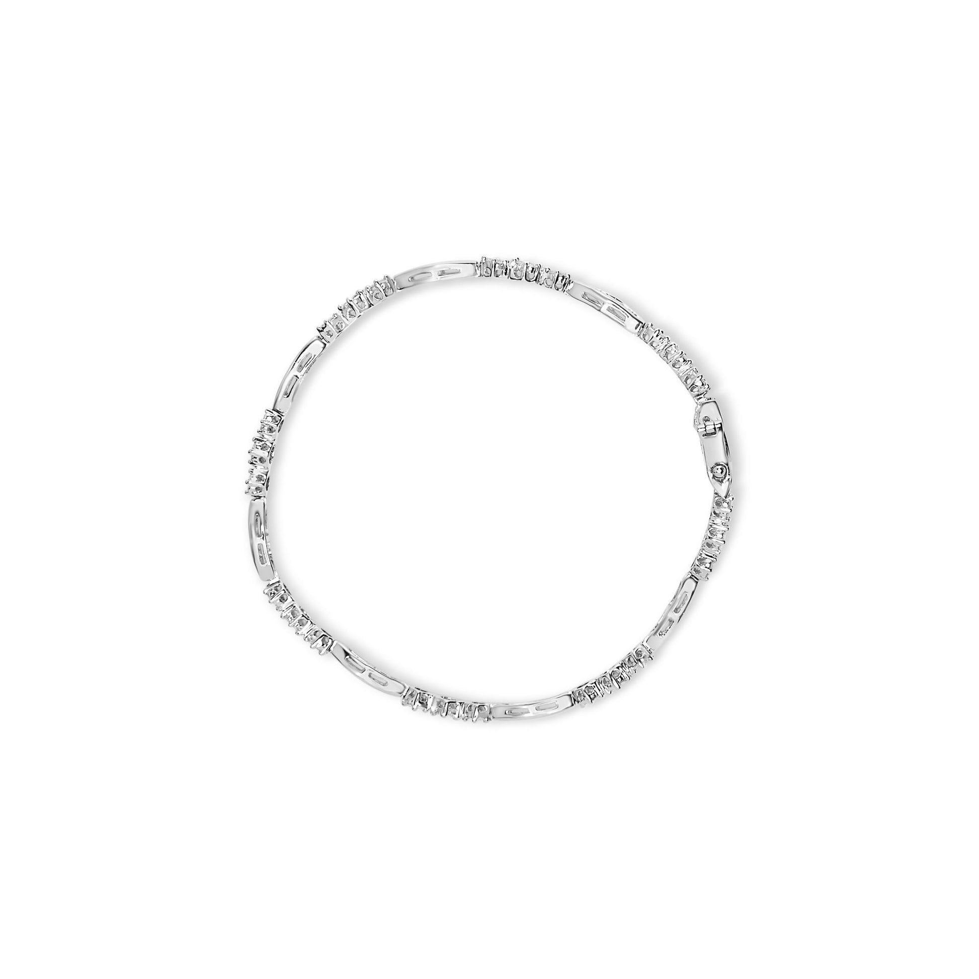 Top-down view of a white metal bracelet featuring sections of baguette-shaped gemstones in a channel setting alternating with sections of round-shaped gemstones in a prong setting.