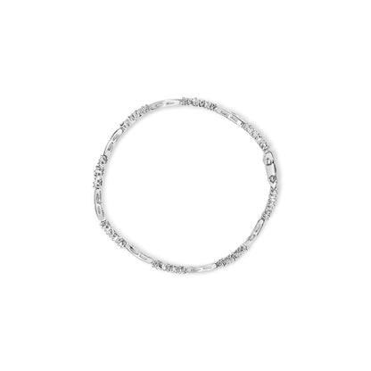 Top-down view of a white metal bracelet featuring sections of baguette-shaped gemstones in a channel setting alternating with sections of round-shaped gemstones in a prong setting.