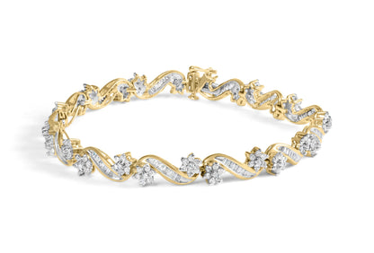 Yellow bracelet with intertwined design featuring round prong-set white gemstones and baguette channel-set white gemstones, shown at an angled top view.