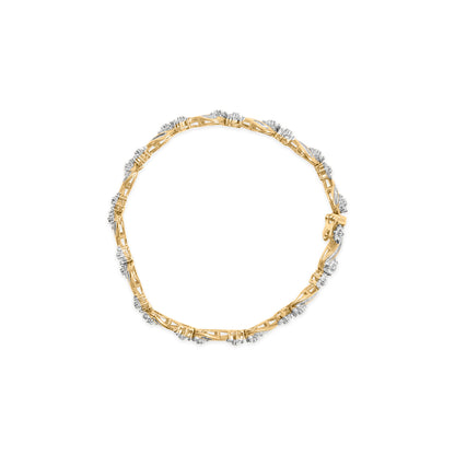 Top-down view of a yellow metal bracelet featuring round prong-set white gemstones and baguette channel-set white gemstones evenly spaced around the band.