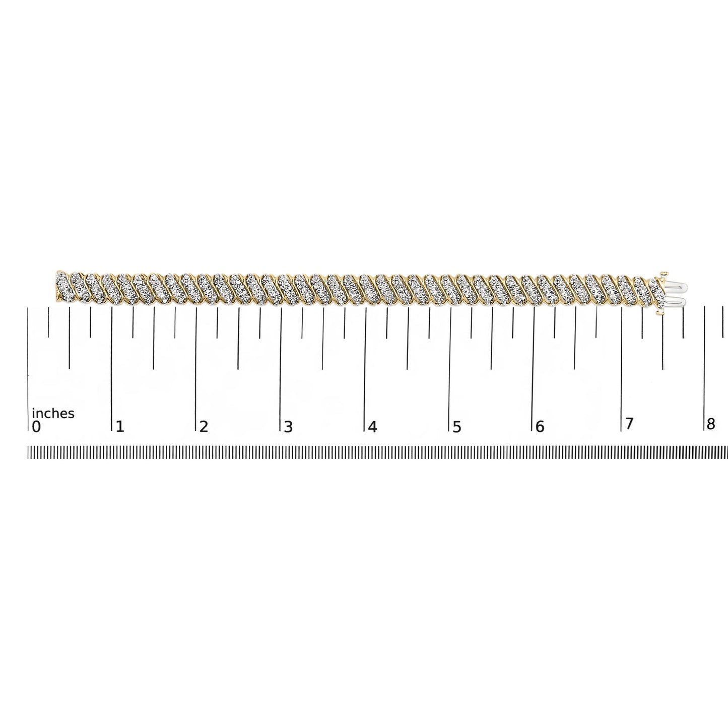 Close-up shot of a yellow metal bracelet with diagonal rows of white round gemstones in prong settings, shown laid flat on a measurement scale.