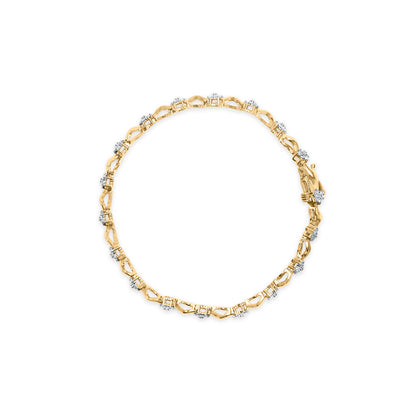Top-down view of a yellow metal bracelet with round white gemstones in prong settings evenly spaced around the band.