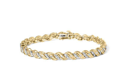 Yellow bracelet with alternating round and baguette white gemstones set in a twisted pattern, shown from a slightly elevated front angle.