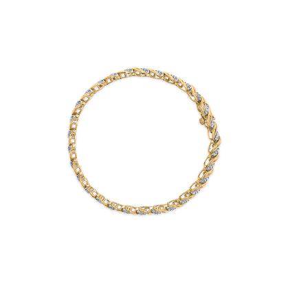Top-down view of a yellow bracelet featuring alternating sections of round white gemstones in prong settings and baguette white gemstones in channel settings.