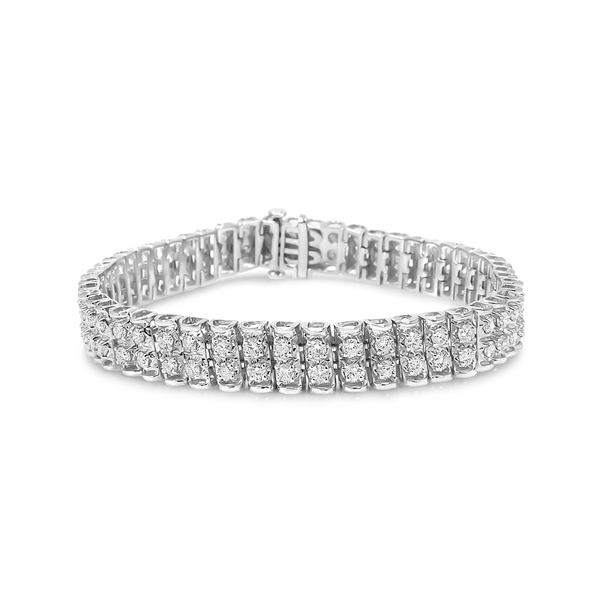 White metal bracelet with rows of prong-set round white gemstones, shown from a slightly angled front view.