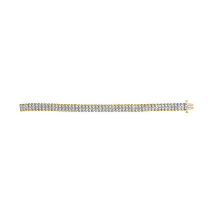 Yellow metal bracelet with two rows of white round gemstones in prong settings, flat lay top view.