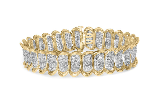 Close-up front angle of a yellow metal bracelet with multiple sections featuring round white gemstones in prong settings.