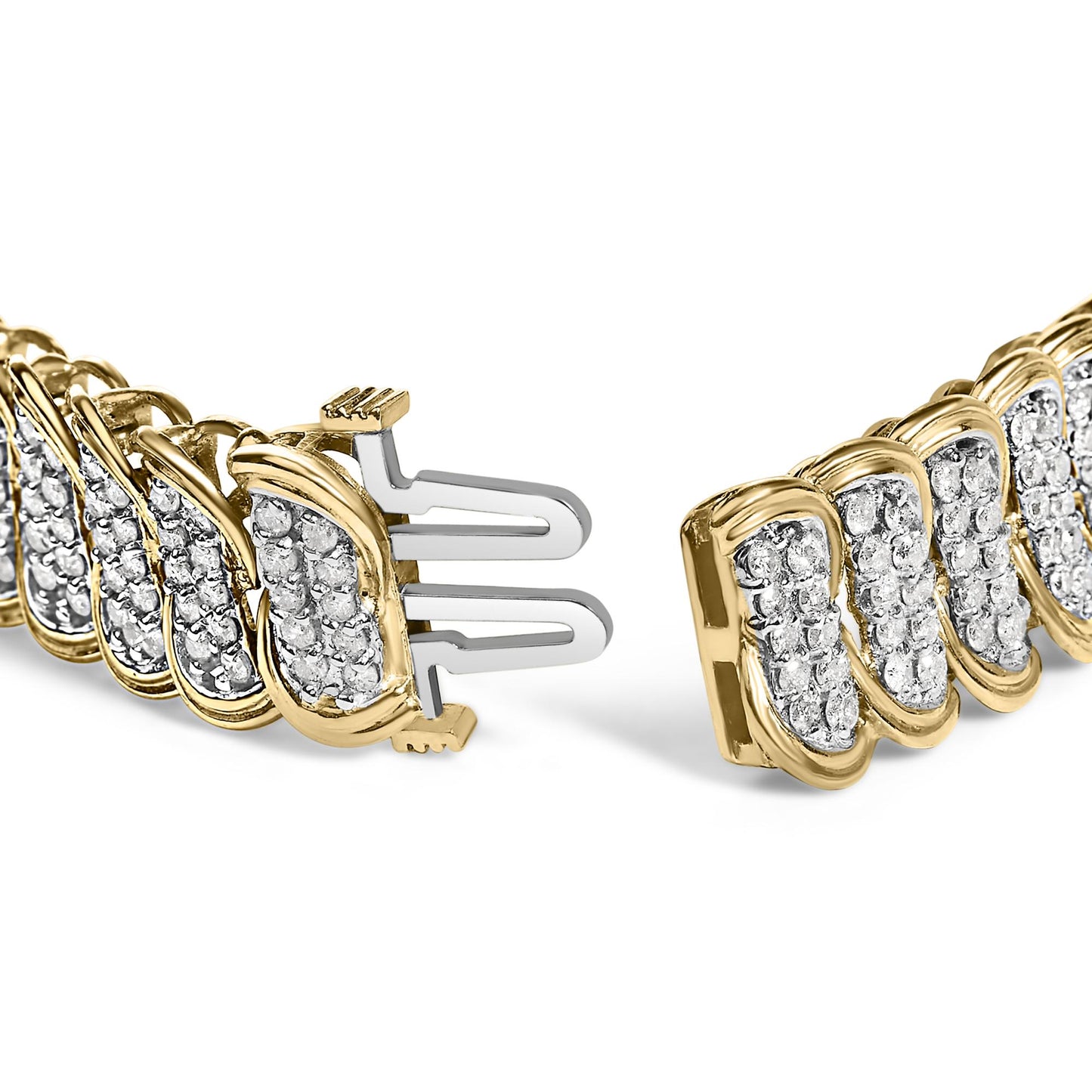 Close-up angle of a yellow metal bracelet featuring multiple clusters of round white gemstones in prong settings, showing the clasp ends.