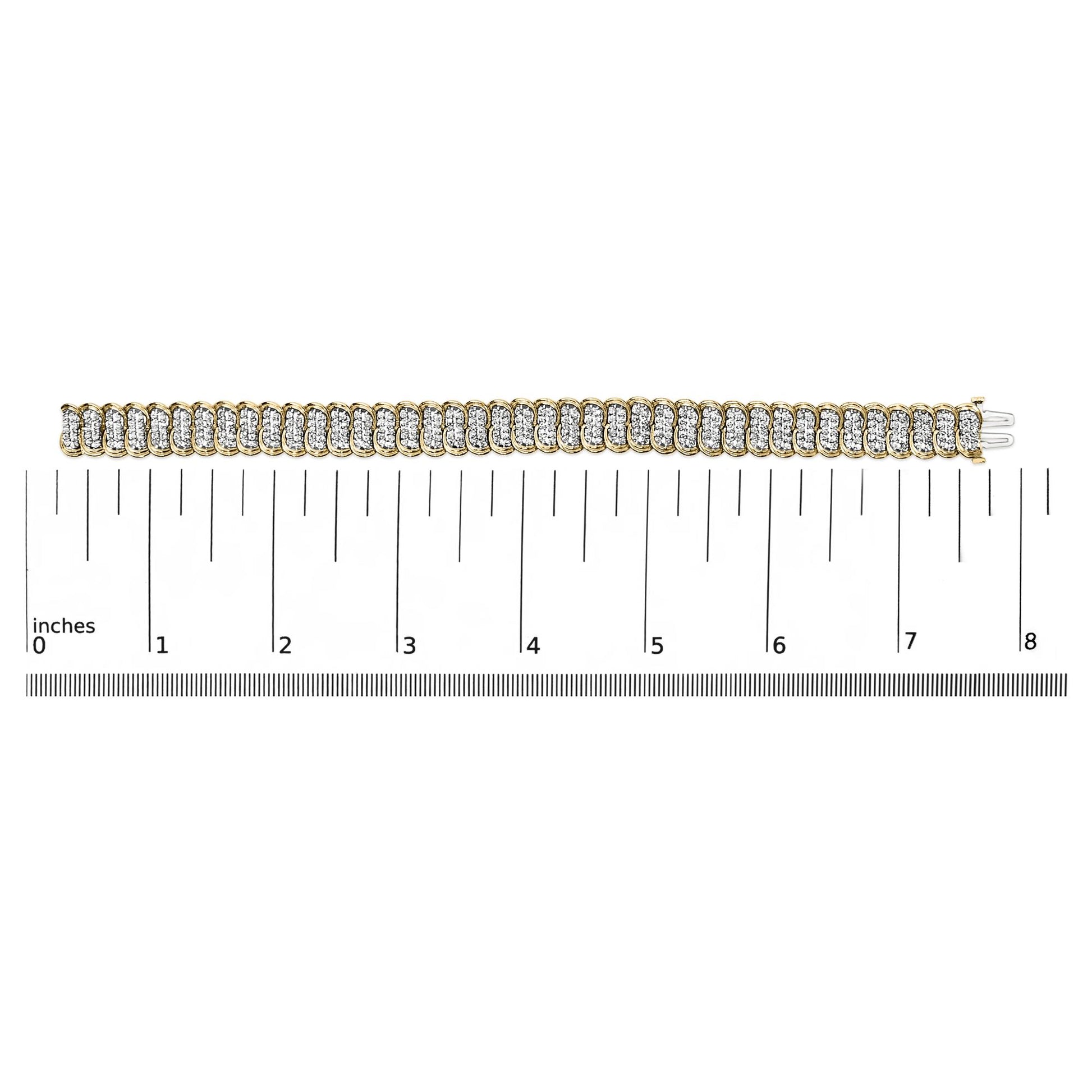 Yellow metal bracelet with multiple white round gemstones in prong settings, shown flat on a scale, photographed from a top-down angle.