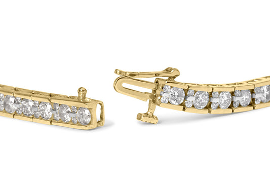 Close-up of a yellow metal bracelet with round white gemstones in prong settings, shown at an angle highlighting the clasp mechanism.