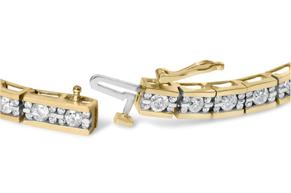 Close-up view of a yellow metal bracelet with channel-set round white gemstones, showing the clasp mechanism.