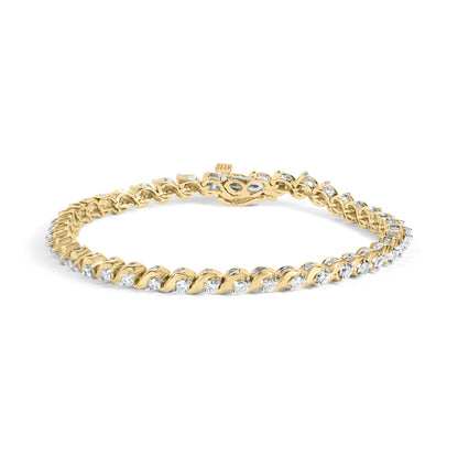 Yellow metal bracelet with round white gemstones in two-prong settings and baguette white gemstones in channel settings, shown from a front angle on a white background.