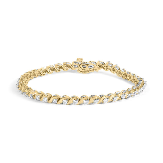 Yellow metal bracelet with round white gemstones in two-prong settings and baguette white gemstones in channel settings, shown from a front angle on a white background.