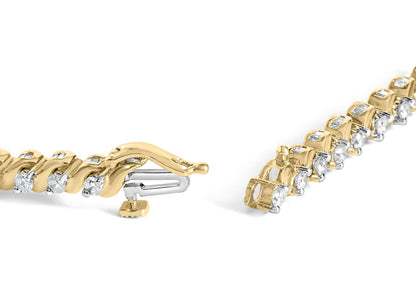 Close-up side angle of a yellow bracelet with alternating round white gemstones in prong settings and baguette white gemstones in channel settings, showing the clasp mechanism.