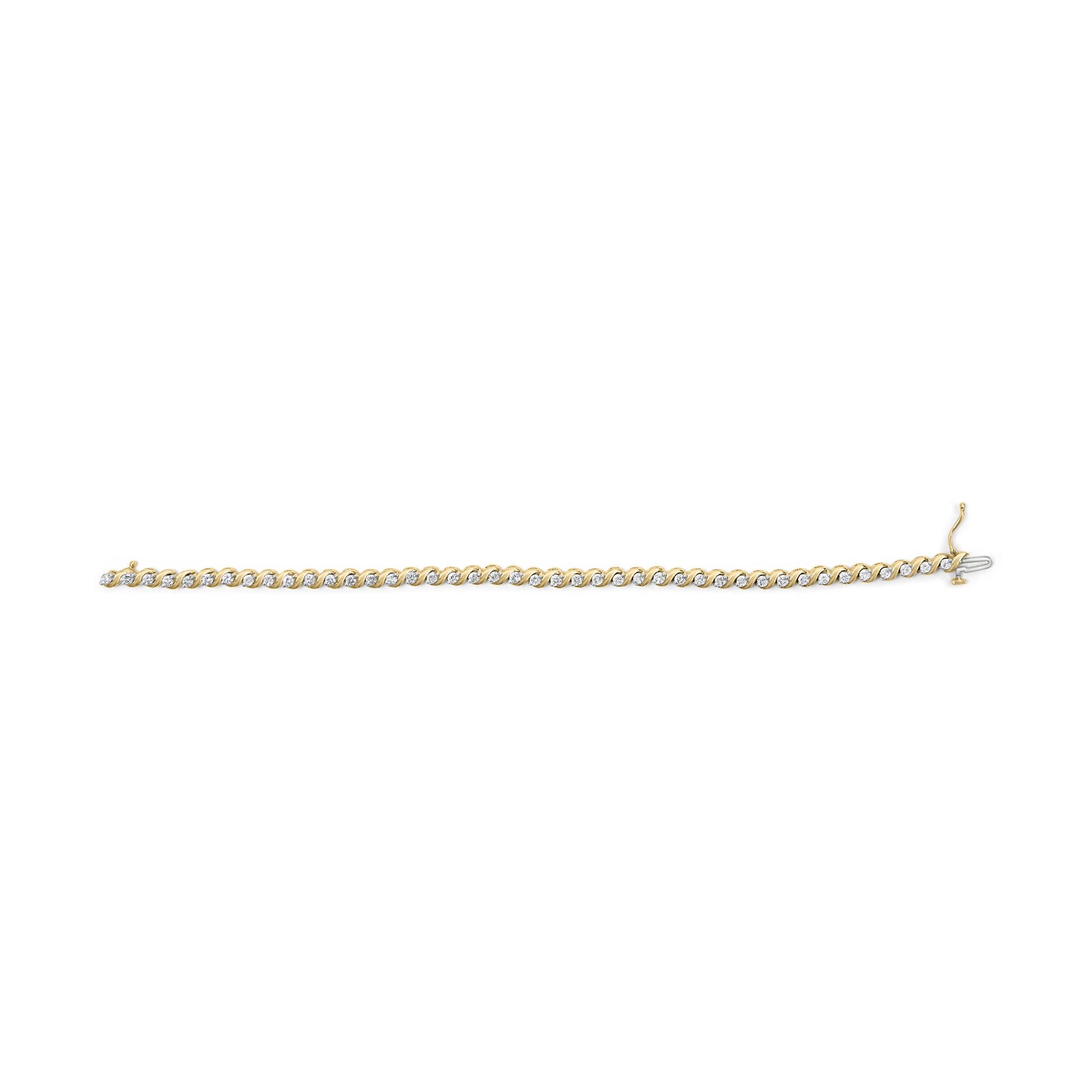 Yellow metal bracelet shown from a top-down angle with round white gemstones in 2-prong settings alternating with baguette white gemstones in channel settings.