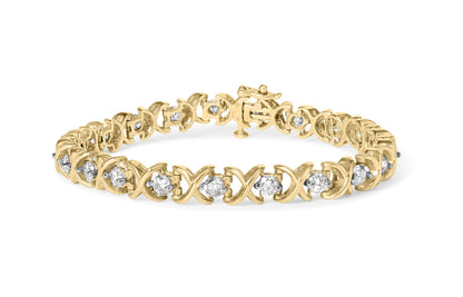 Yellow metal bracelet with round white gemstones in prong settings, shown in a front angled view.