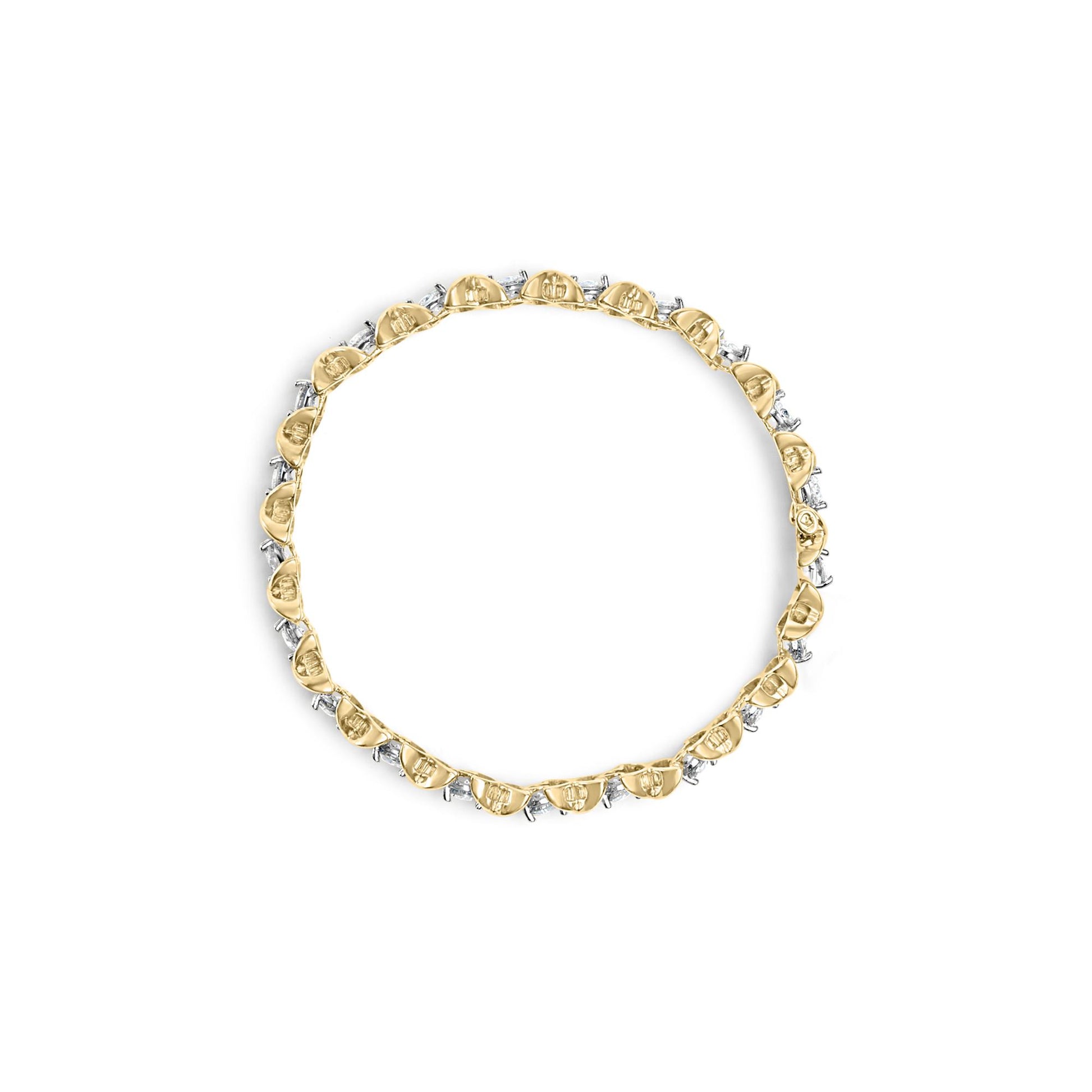 Top-down view of a yellow bracelet featuring alternating round prong-set white gemstones and baguette channel-set white gemstones.