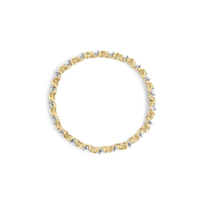 Top-down view of a yellow bracelet featuring alternating round prong-set white gemstones and baguette channel-set white gemstones.