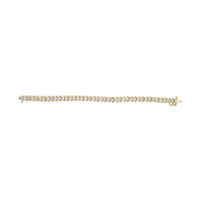 Top-down view of a yellow metal bracelet featuring round white gemstones in prong settings alternated with crossed metal links.