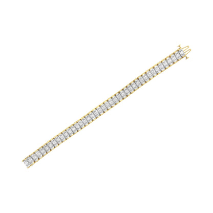 Bracelet with yellow and white metal featuring round white gemstones in prong settings and baguette white gemstones in channel settings, shown flat on a white background from a top angle.