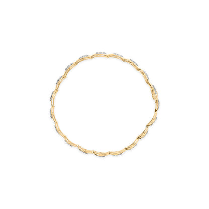 Top-down view of a yellow bracelet with round white gemstones in prong settings along its linked design.