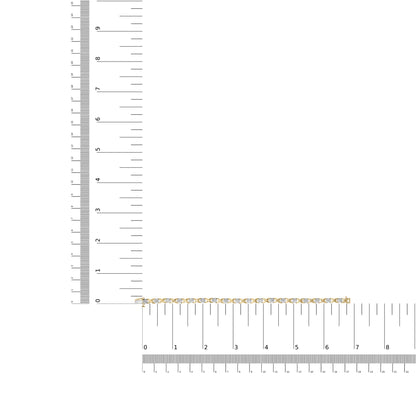 Bracelet with white metal and white round and baguette gemstones, shown flat on intersecting rulers for size reference, top-down angle.