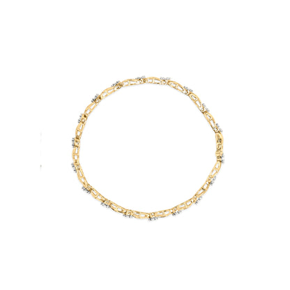 Top-down view of a yellow metal bracelet with multiple sections set with small round white gemstones in a pave setting.