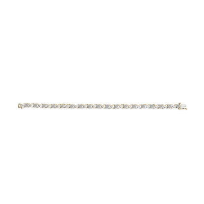 Yellow bracelet with an interwoven pattern of white round gemstones in pave setting, shown flat from a top-down angle.