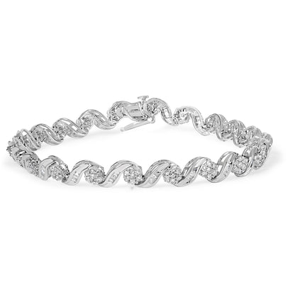 White metal bracelet with alternating round and baguette-shaped white gemstones in prong and channel settings, shot from the front angle on a white background.