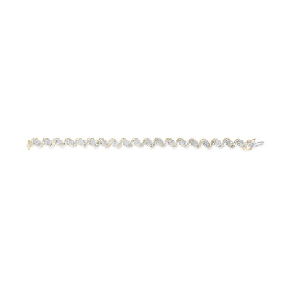 Yellow metal bracelet with alternating round prong-set white gemstones and twisted bands with channel-set baguette white gemstones, shown in a flat lay from above.