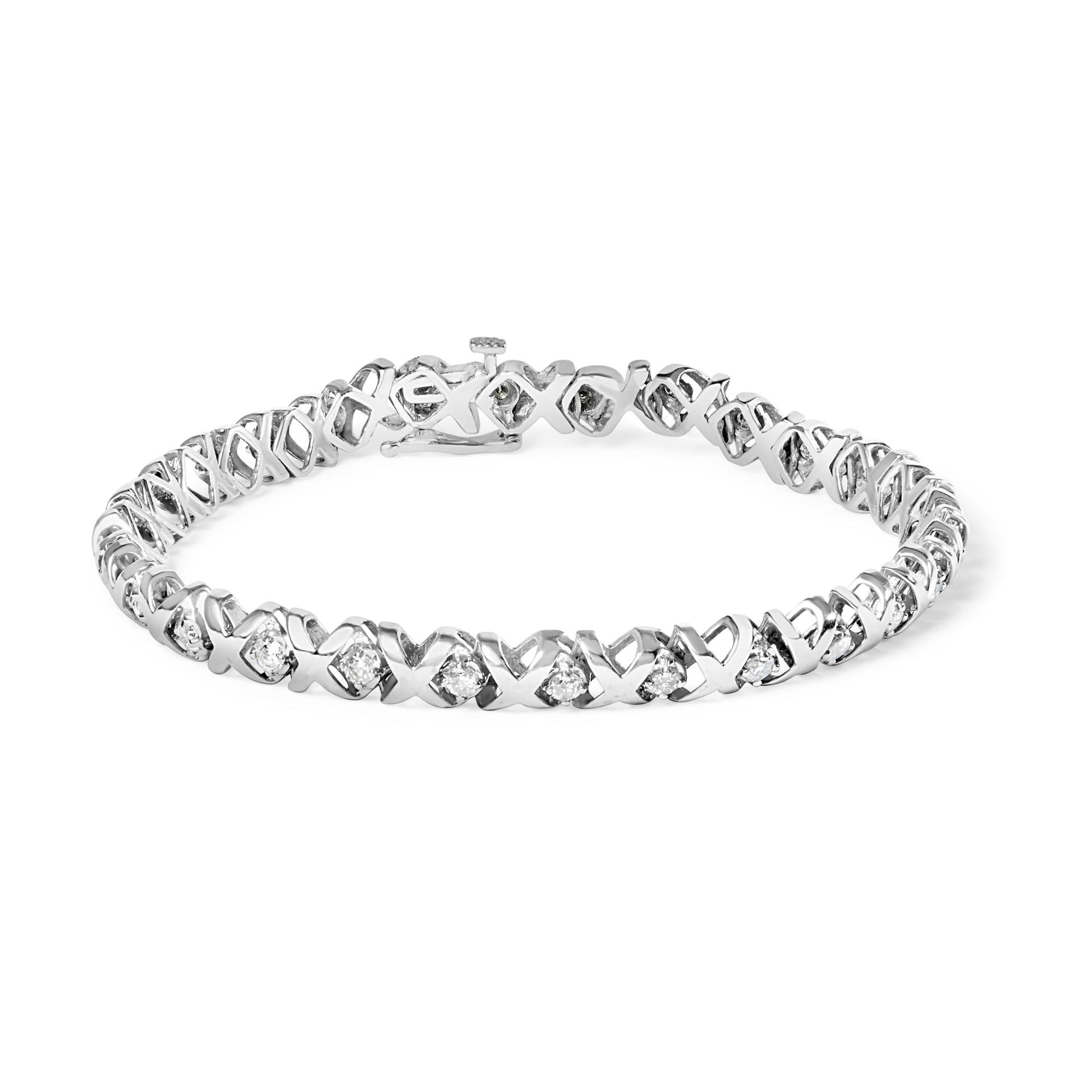 White metal bracelet with alternating X-shaped links and round white gemstones in prong settings, shown at a slight angle.