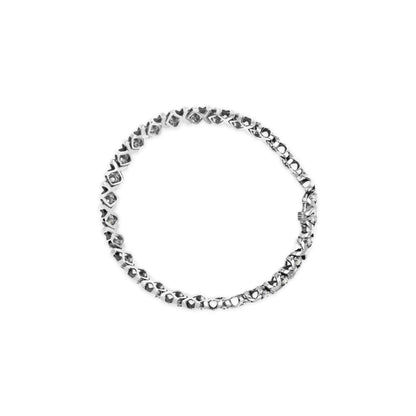 White metal bracelet with two rows of round white gemstones in prong settings, shown flat from a top-down angle.