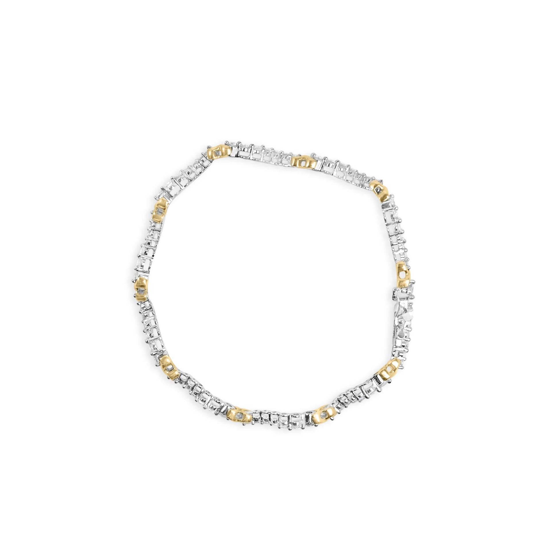 Top-down view of a yellow and white metal bracelet with alternating sections set with small round white gemstones.