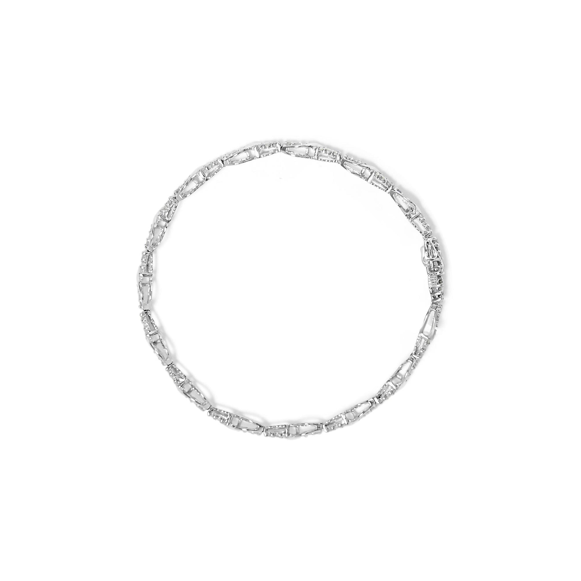Top-down view of a white metal bracelet with linked sections featuring round white gemstones in prong settings.