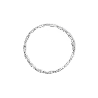 Top-down view of a white metal bracelet with linked sections featuring round white gemstones in prong settings.