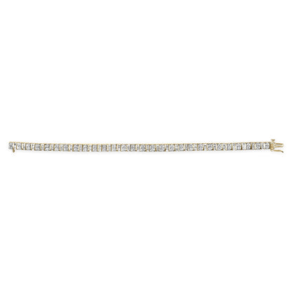 Side angle view of a yellow bracelet with alternating rows of round prong-set white gemstones and baguette channel-set white gemstones.