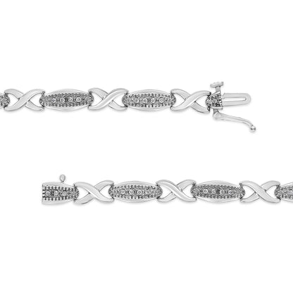 White metal bracelet with alternating oval and X-shaped links, each oval link set with multiple small white round gemstones in prong settings, shown in a flat layout from a top-down angle.
