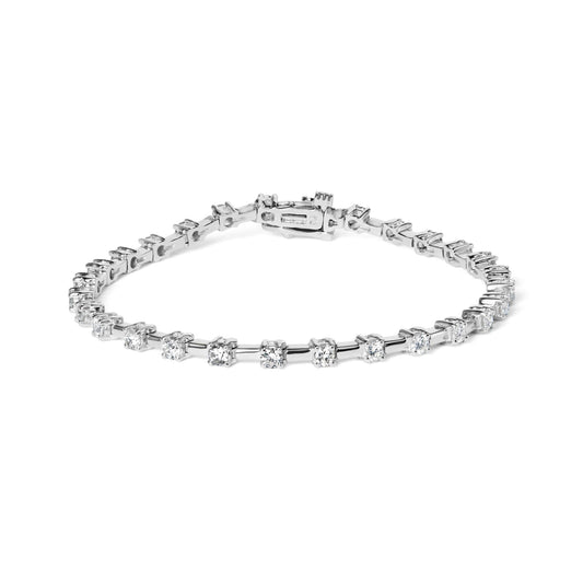 White metal bracelet with round white gemstones in prong settings, shown from a front angled view on a white background.