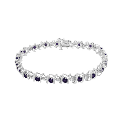 White metal bracelet with alternating round purple and white gemstones in prong settings, shown from a front angle on a white background.