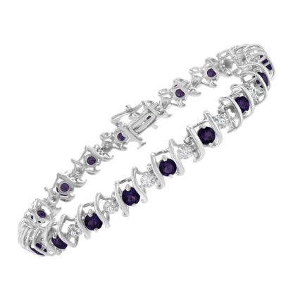 White metal bracelet with alternating round purple gemstones and white gemstones in prong settings, shown at an angled close-up.