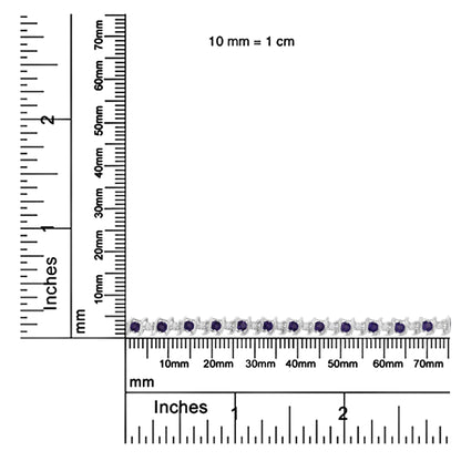 Bracelet with alternating round purple and white gemstones in prong settings, shown on a ruler for size reference, top-down angle.